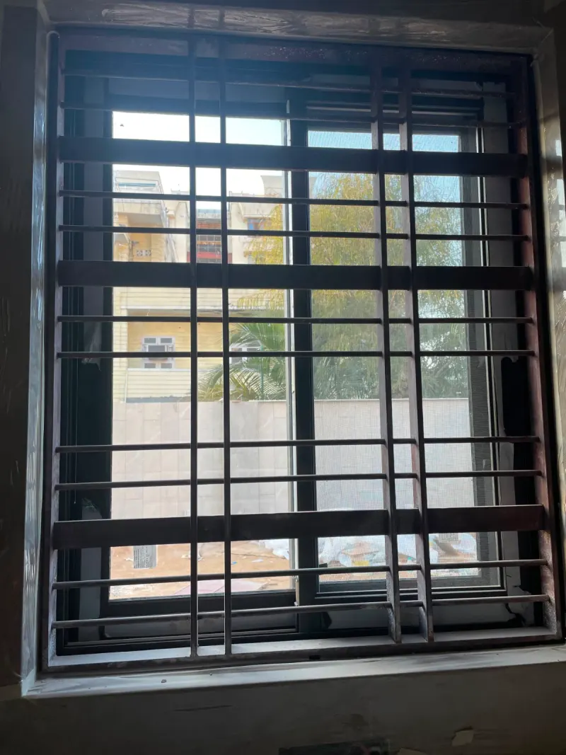 Vertical window grill design, available in aluminium, iron and brass - strong safety for homes